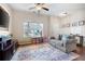 Spacious living room with hardwood floors and a large window at 311 Tuggle Ct, Woodstock, GA 30188