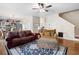 Comfortable living room with hardwood floors and ceiling fan at 311 Tuggle Ct, Woodstock, GA 30188