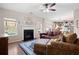 Open living room showcasing a fireplace and built-in shelving at 311 Tuggle Ct, Woodstock, GA 30188