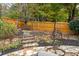 Stone patio with built-in seating, a wooden swing, and landscaping at 3214 Burnette Ne Dr, Roswell, GA 30075