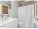 Clean bathroom with a shower/tub combo and white vanity at 3214 Burnette Ne Dr, Roswell, GA 30075