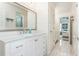 White bathroom with shiplap walls and a view into bedroom at 3214 Burnette Ne Dr, Roswell, GA 30075