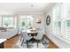 Charming dining room with wood table and gray chairs near the kitchen at 3214 Burnette Ne Dr, Roswell, GA 30075