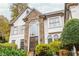 Front view of a charming two-story home with stone details at 3214 Burnette Ne Dr, Roswell, GA 30075