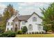 Two-story house with stone accents and manicured lawn at 3214 Burnette Ne Dr, Roswell, GA 30075