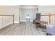 Spacious hallway with hardwood floors and seating area at 3214 Burnette Ne Dr, Roswell, GA 30075