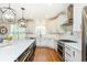 Spacious kitchen with island, stainless steel appliances, and white cabinets at 3214 Burnette Ne Dr, Roswell, GA 30075