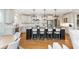 Modern kitchen with a large island and dark wood cabinets at 3214 Burnette Ne Dr, Roswell, GA 30075