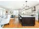 Modern kitchen with large island and dark wood cabinets at 3214 Burnette Ne Dr, Roswell, GA 30075