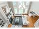 Two-story living room with hardwood floors and fireplace at 3214 Burnette Ne Dr, Roswell, GA 30075