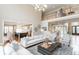 Open living room with a view into the kitchen and foyer at 3214 Burnette Ne Dr, Roswell, GA 30075