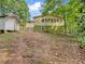 House exterior with a large backyard and shed at 170 Pinehurst Dr, Stockbridge, GA 30281