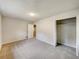 Spacious bedroom with neutral carpeting and a large closet at 170 Pinehurst Dr, Stockbridge, GA 30281