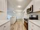 Renovated kitchen with island and stainless steel appliances at 170 Pinehurst Dr, Stockbridge, GA 30281
