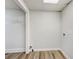 Basement laundry area with vinyl flooring and shelving at 170 Pinehurst Dr, Stockbridge, GA 30281
