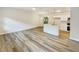 Open living space with kitchen and vinyl plank flooring at 170 Pinehurst Dr, Stockbridge, GA 30281