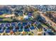 Aerial view of a residential neighborhood with houses, a park, and a school at 214 Walnut Ridge Rd, Canton, GA 30115