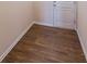 Small hallway with wood-look flooring and a door to another room at 214 Walnut Ridge Rd, Canton, GA 30115
