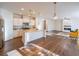 Open kitchen boasts an island, stainless steel appliances, and granite countertops at 214 Walnut Ridge Rd, Canton, GA 30115