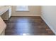 Spacious home office features wood-look flooring and built-in cabinetry at 214 Walnut Ridge Rd, Canton, GA 30115