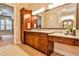 Elegant bathroom with double vanity and granite countertop at 3190 Celebration Blvd, Suwanee, GA 30024