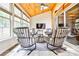 Bright sunroom with plenty of windows and comfortable seating at 3190 Celebration Blvd, Suwanee, GA 30024