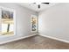 Bright bedroom with carpet flooring and large windows at 607 Walker Ct, Canton, GA 30115