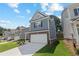 Two-story house with gray siding, white garage door, and landscaped lawn at 730 Brickelberry Court, Marietta, GA 30066