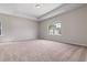 Spacious main bedroom with carpeted floors and large window at 730 Brickelberry Court, Marietta, GA 30066