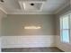 Elegant dining room features a modern chandelier and wainscoting at 2902 Centerville Rosebud Rd, Snellville, GA 30039