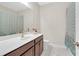 Bright bathroom featuring a spacious vanity, framed mirror, and patterned shower curtain at 4259 Hansford Loop, Marietta, GA 30064