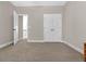 Spacious bedroom with plush carpet, an open doorway and large closet at 4259 Hansford Loop, Marietta, GA 30064