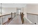Upstairs hallway features carpet floors and decorative metal railings at 4259 Hansford Loop, Marietta, GA 30064