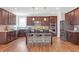 Gourmet kitchen featuring stainless steel appliances, a center island with seating, and granite countertops at 4259 Hansford Loop, Marietta, GA 30064