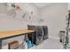 Bright laundry room with washer, dryer, and ample shelving at 4259 Hansford Loop, Marietta, GA 30064