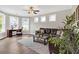 Inviting living room with a cozy seating area, wood floors, and plenty of natural light from multiple windows at 4259 Hansford Loop, Marietta, GA 30064