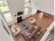 Open-concept living room featuring a fireplace, soaring ceilings, and seamless flow to the kitchen and dining area at 4259 Hansford Loop, Marietta, GA 30064
