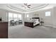 Spacious main bedroom with tray ceiling, carpet floors and sitting area at 4259 Hansford Loop, Marietta, GA 30064