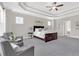 Spacious main bedroom with tray ceiling, carpet floors and sitting area at 4259 Hansford Loop, Marietta, GA 30064