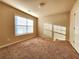 Bright bedroom with large window and neutral decor at 5150 Amberland Sq, Atlanta, GA 30349