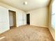 Bedroom with double door closet and neutral walls at 5150 Amberland Sq, Atlanta, GA 30349