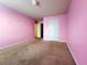 Spacious bedroom with neutral walls and carpet at 5150 Amberland Sq, Atlanta, GA 30349