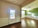 Bright entryway with hardwood floors and access to the living and dining areas at 5150 Amberland Sq, Atlanta, GA 30349