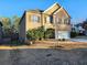 Two-story home showcasing a large yard and brick facade at 5150 Amberland Sq, Atlanta, GA 30349