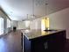 Open kitchen features granite countertops and a large island at 5150 Amberland Sq, Atlanta, GA 30349