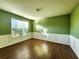 Living room with hardwood floors and a wall of windows at 5150 Amberland Sq, Atlanta, GA 30349