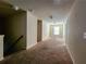 Upstairs hallway with carpeted floors and multiple doors to bedrooms at 5150 Amberland Sq, Atlanta, GA 30349