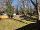 Large backyard with mature trees and a fenced perimeter at 1528 Alder Sw Ln, Atlanta, GA 30311