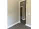 Hallway with neutral-toned walls and hardwood floors at 1528 Alder Sw Ln, Atlanta, GA 30311