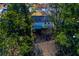 Aerial view of a house nestled among tall trees at 2036 E Camellia Dr, Decatur, GA 30032